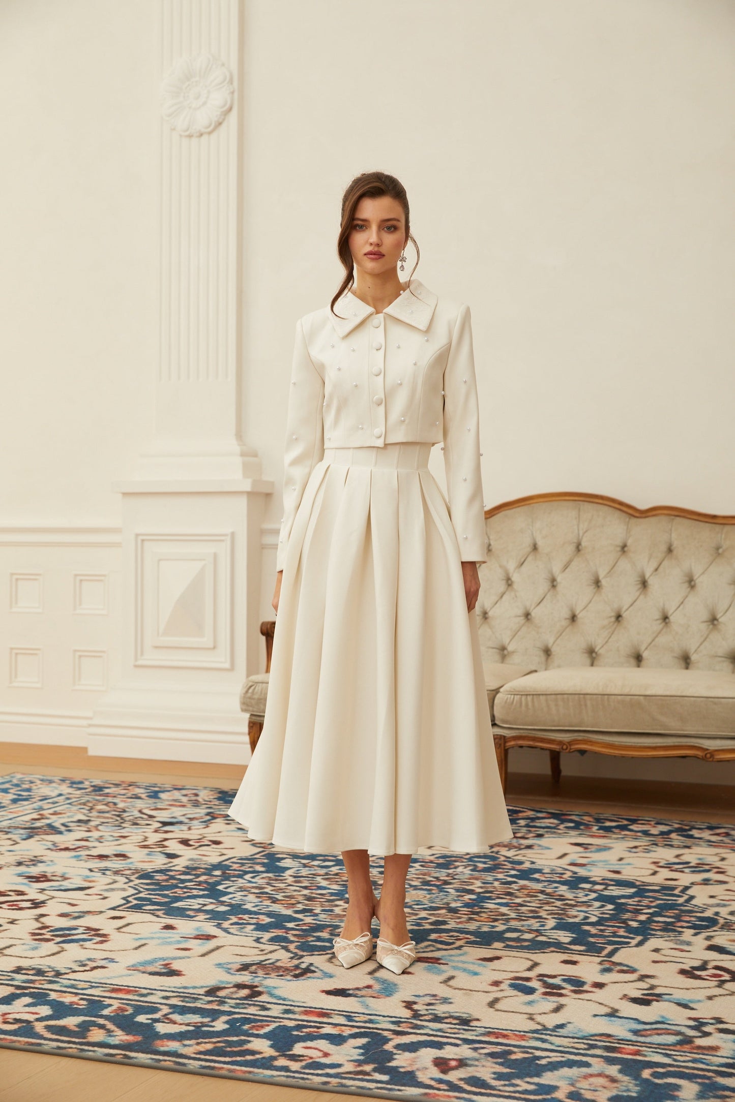 Conjunto de chaqueta y falda plisada