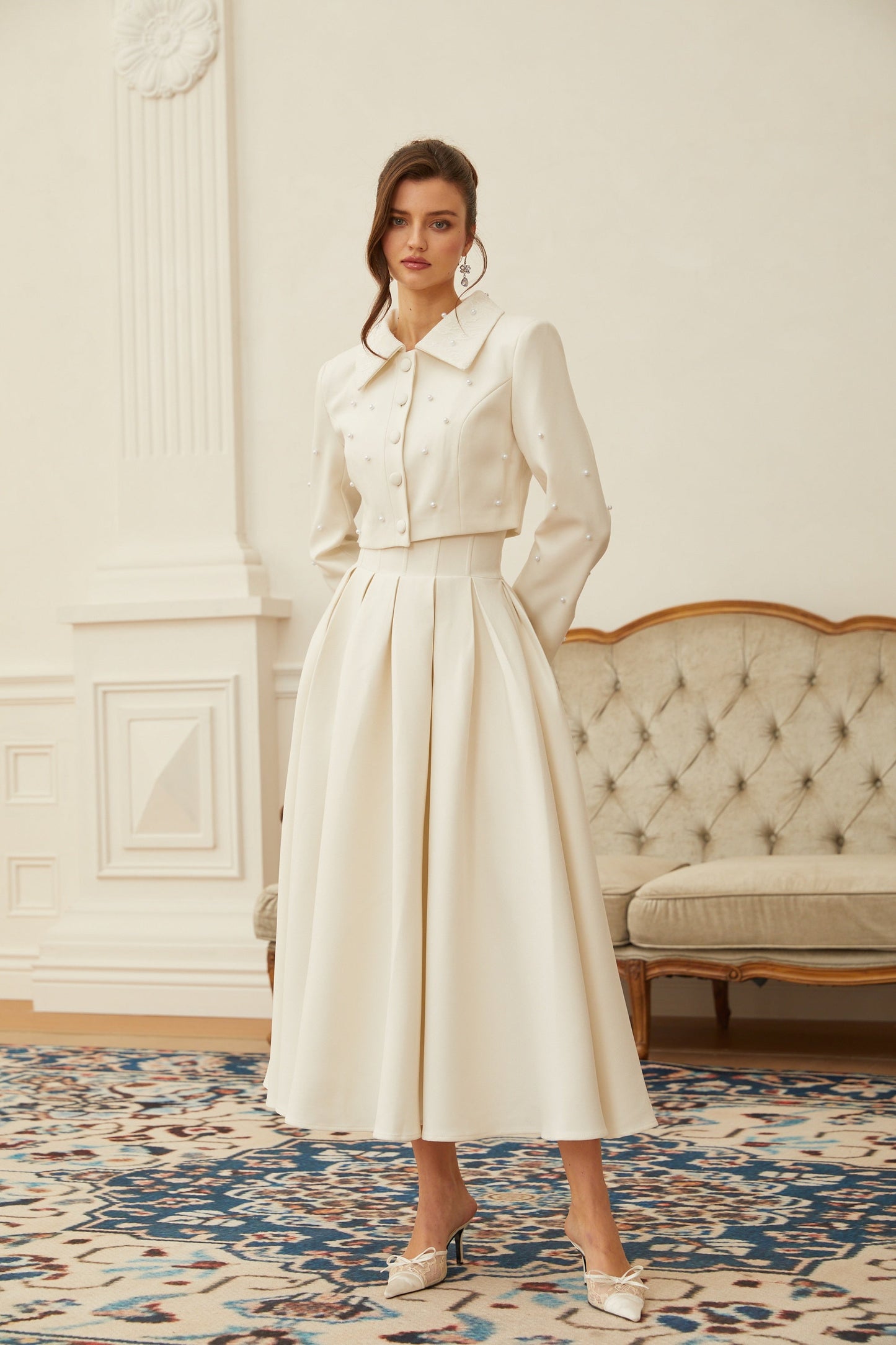 Conjunto de chaqueta y falda plisada