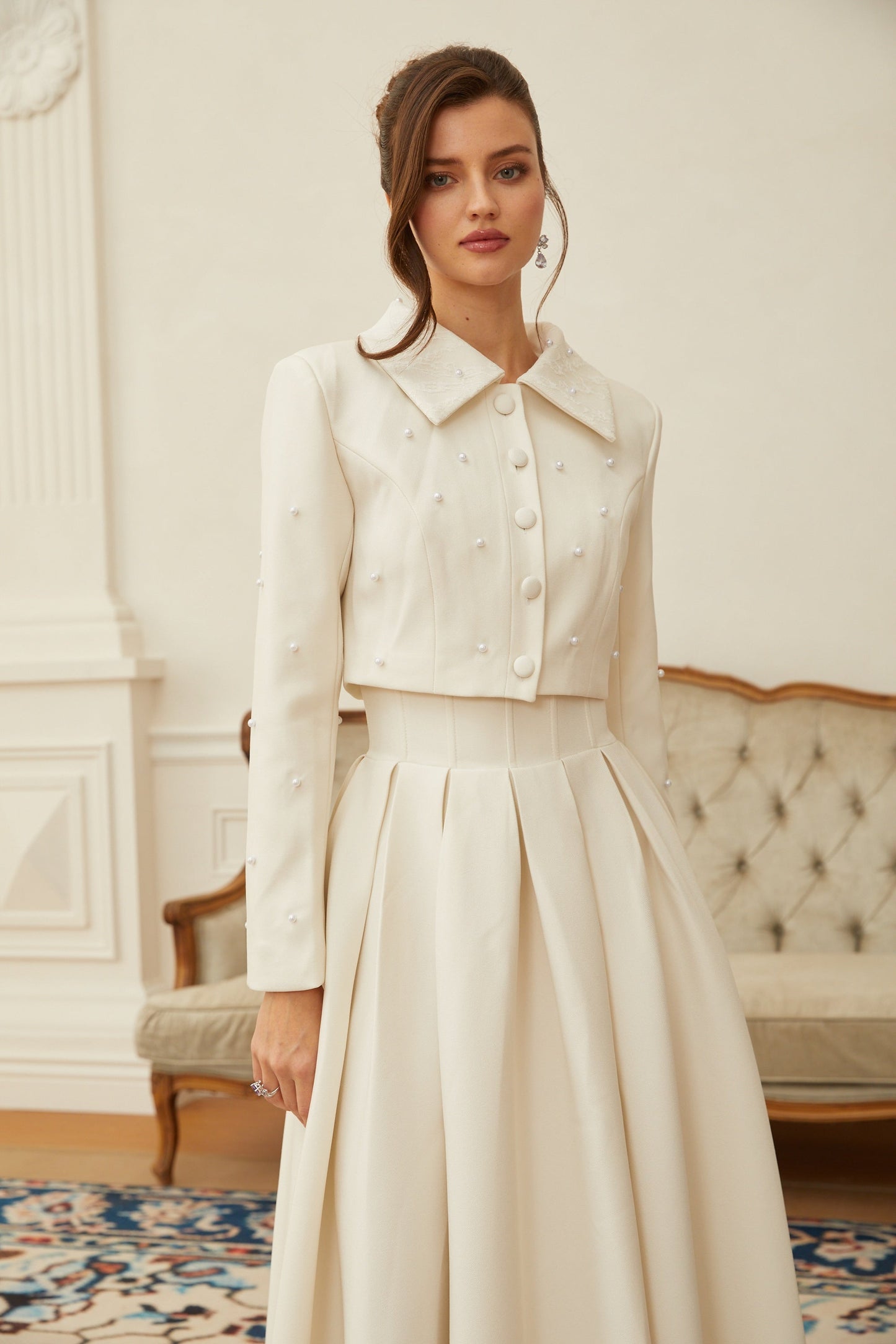 Conjunto de chaqueta y falda plisada