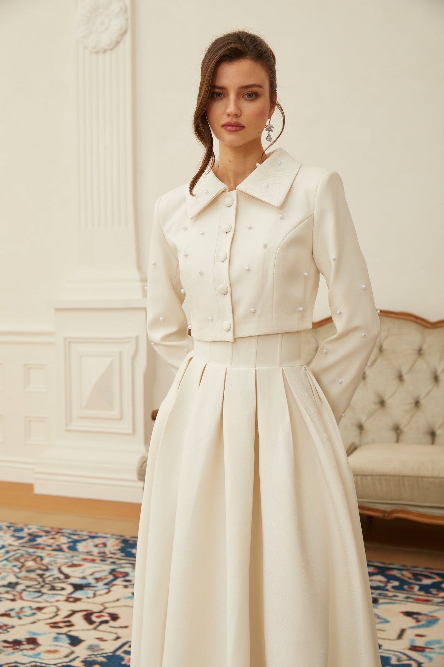 Conjunto de chaqueta y falda plisada