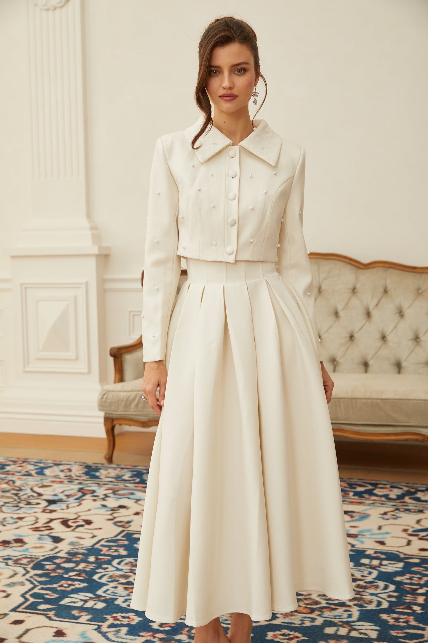 Conjunto de chaqueta y falda plisada