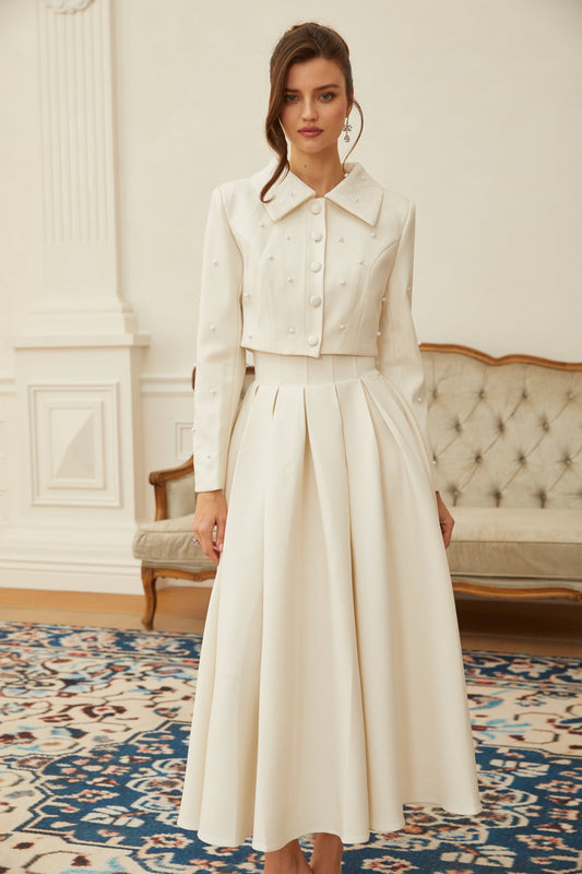 Conjunto de chaqueta y falda plisada
