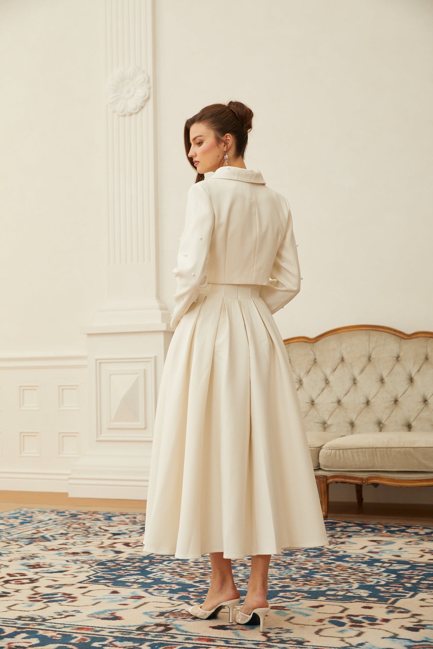 Conjunto de chaqueta y falda plisada