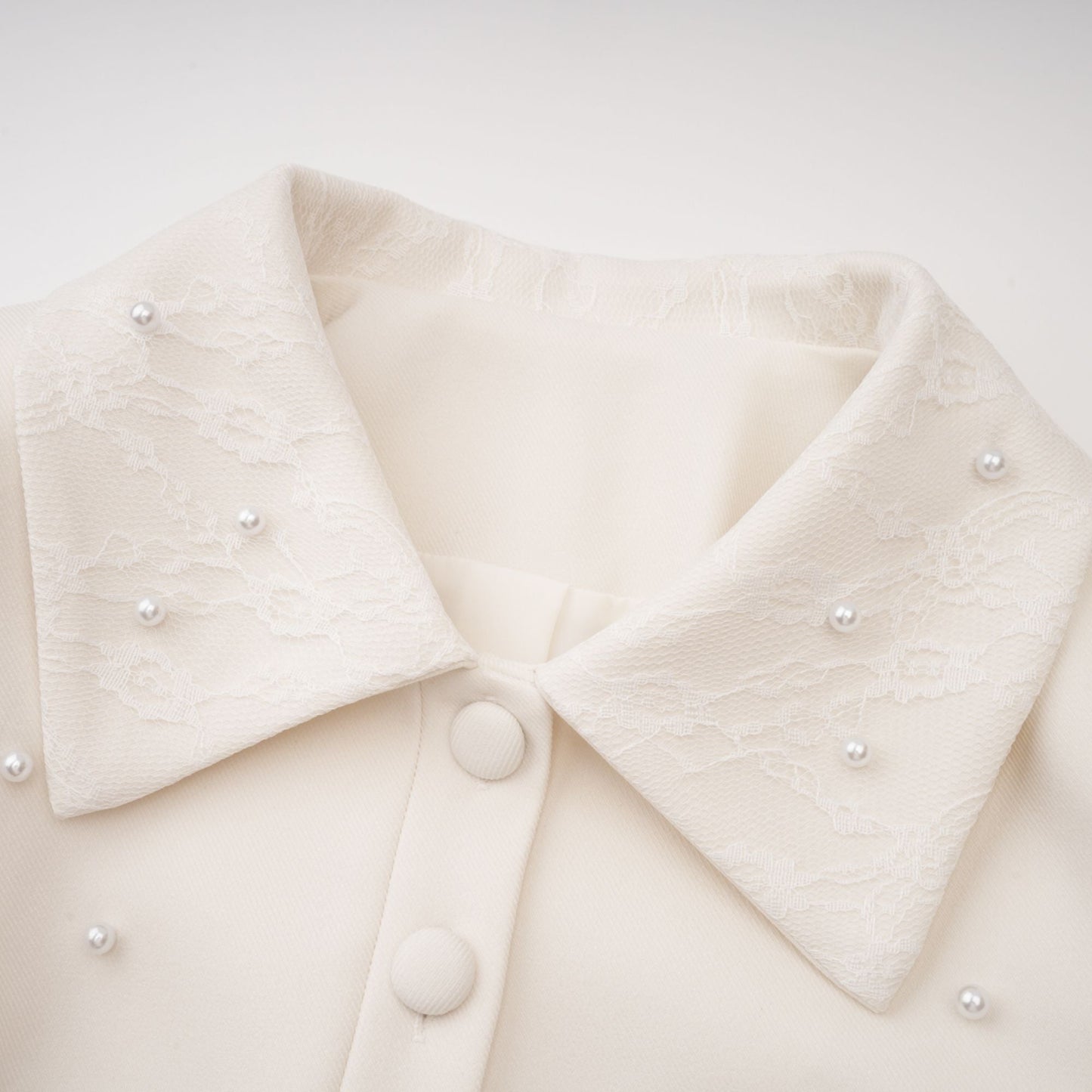Conjunto de chaqueta y falda plisada