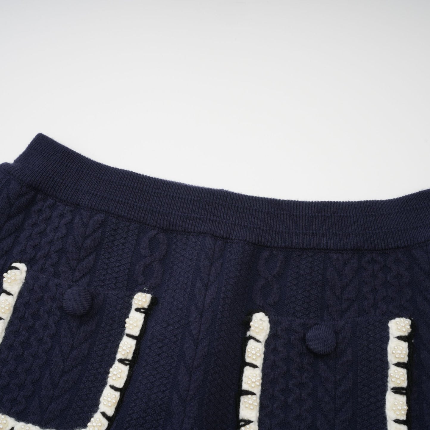 Chaqueta de punto azul marino y pantalones