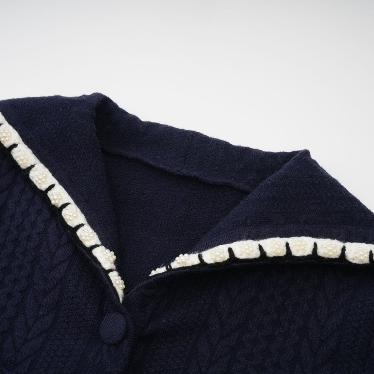 Chaqueta de punto azul marino y pantalones