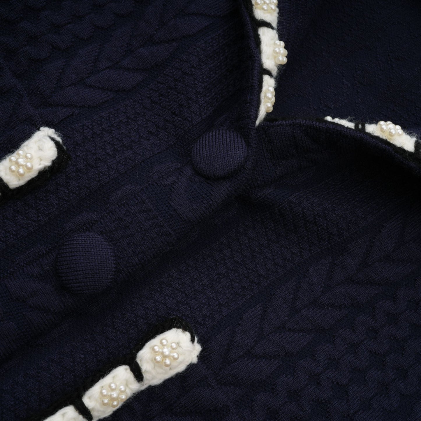 Chaqueta de punto azul marino y pantalones