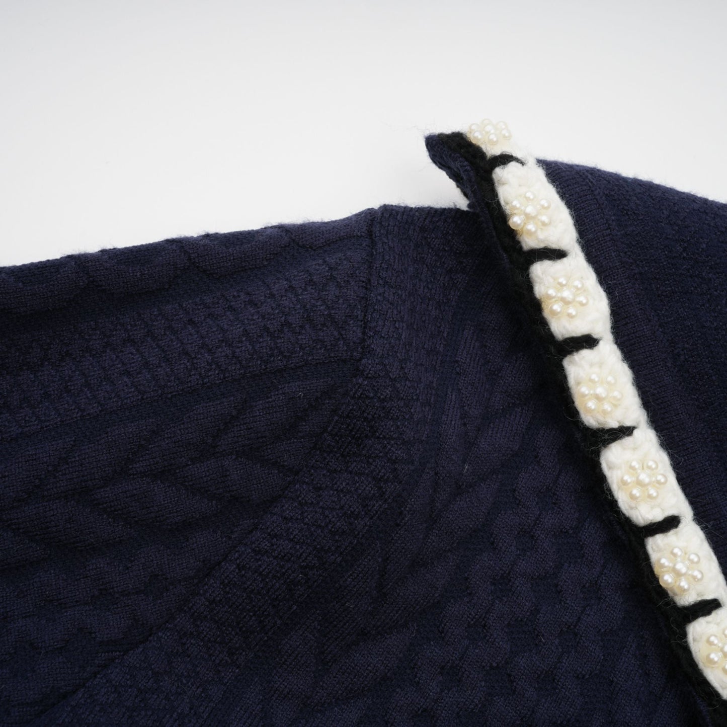Chaqueta de punto azul marino y pantalones