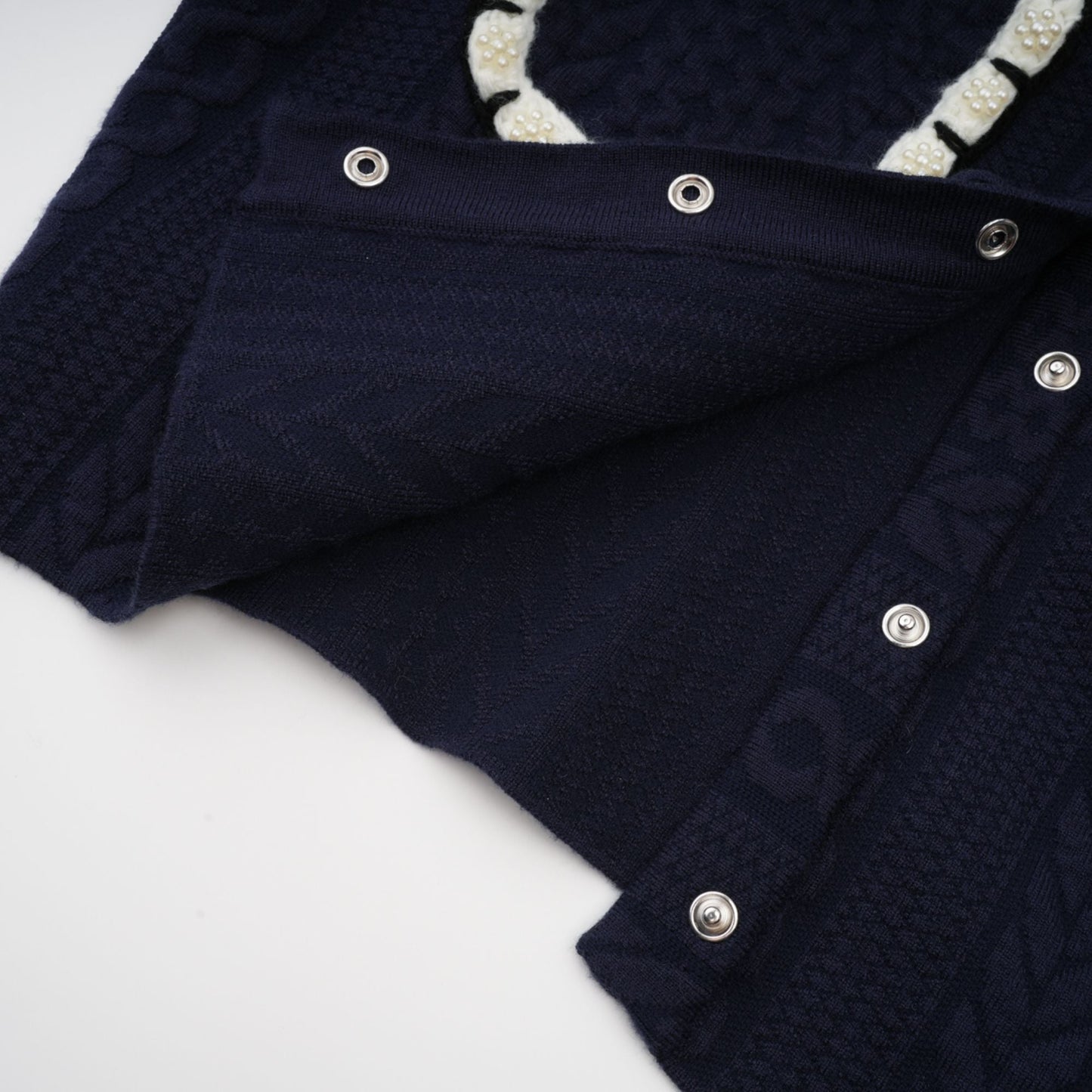 Chaqueta de punto azul marino y pantalones