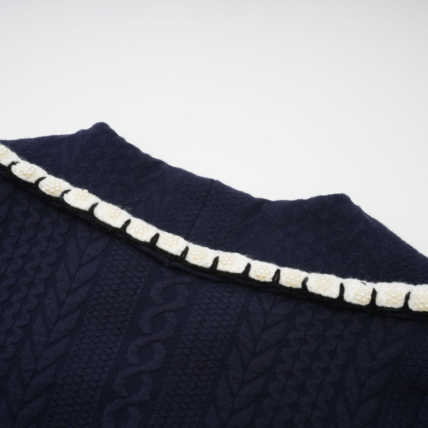 Chaqueta de punto azul marino y pantalones